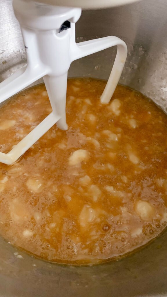 Mashed bananas and the wet ingredients for fresh milled banana bread coffee cake mixed together