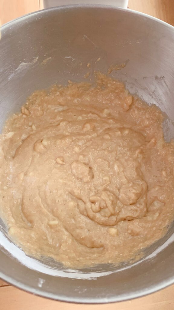 The dry and wet ingredients for fresh milled banana bread coffee cake mixed together