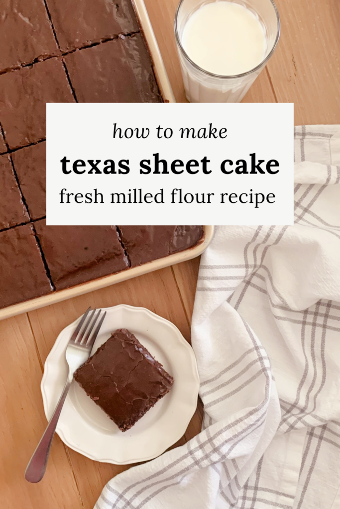 A pin for Pinterest of Fresh milled Texas Sheet cake cut into squares in a pan next to a glass of milk, a tea towel, and a plate with a slice of cake next to a fork on a wooden surface