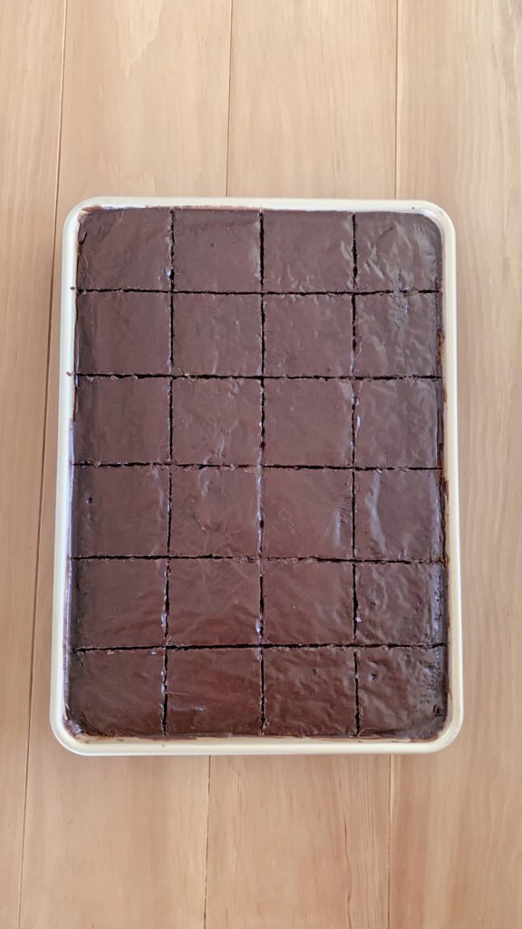 A fresh milled Texas sheet cake iced and cut into squares to eat