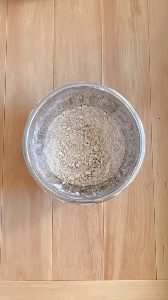 A crumbly butter and dry ingredient mixture for fresh milled cherry coffee cake