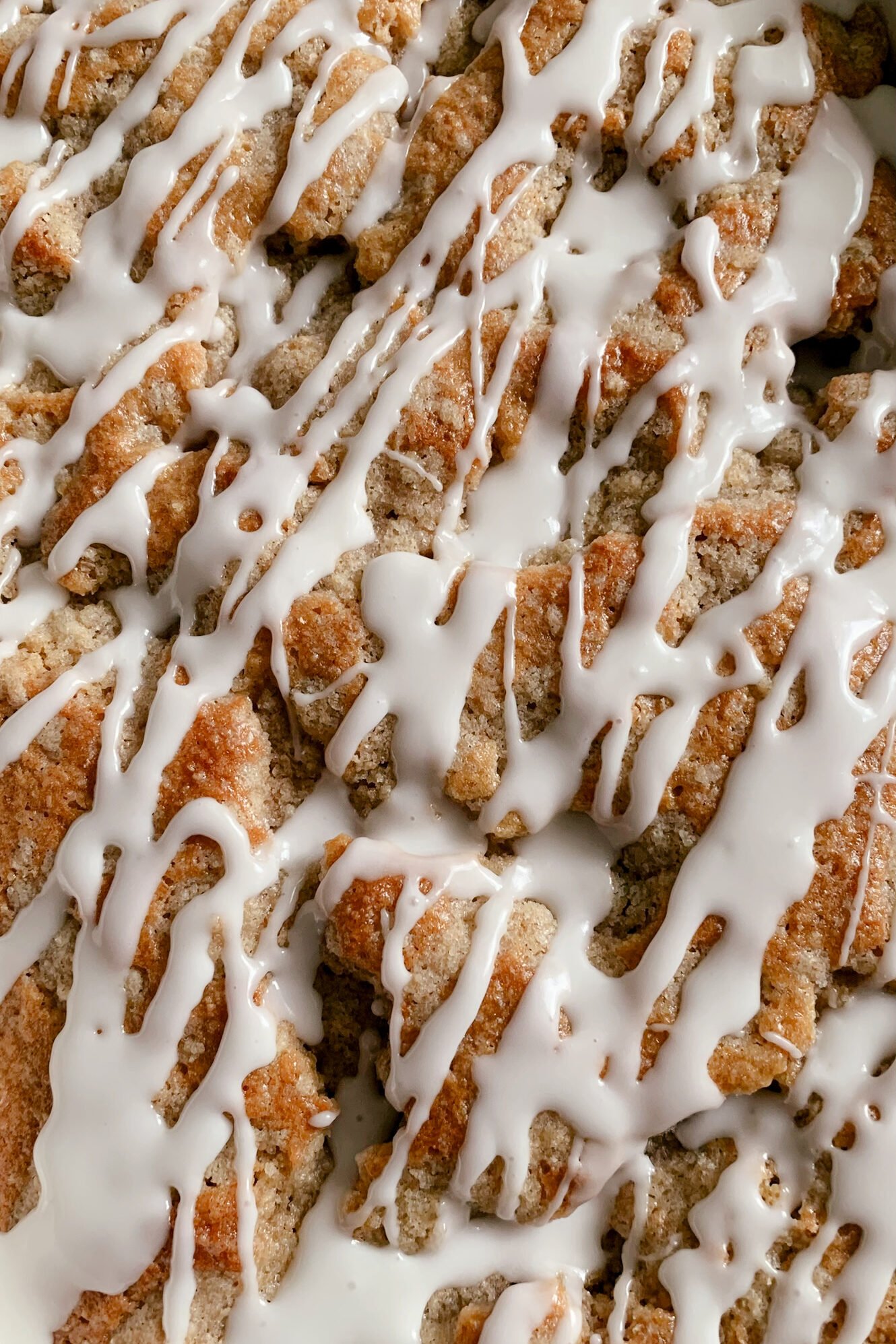 powdered sugar glaze drizzled on fresh milled cherry coffee cake
