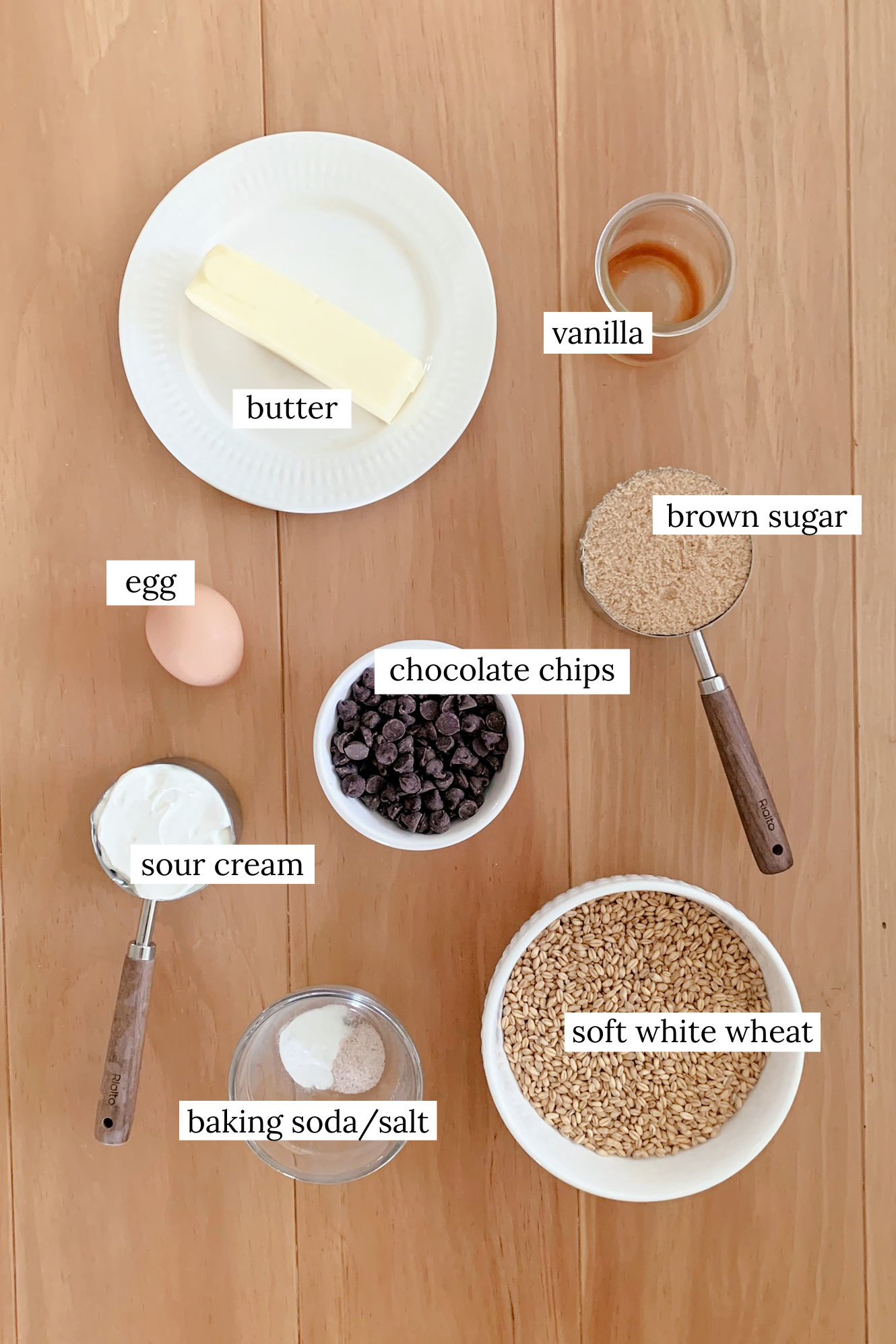 Ingredients for fresh milled chocolate chip cookie bars on a wooden table