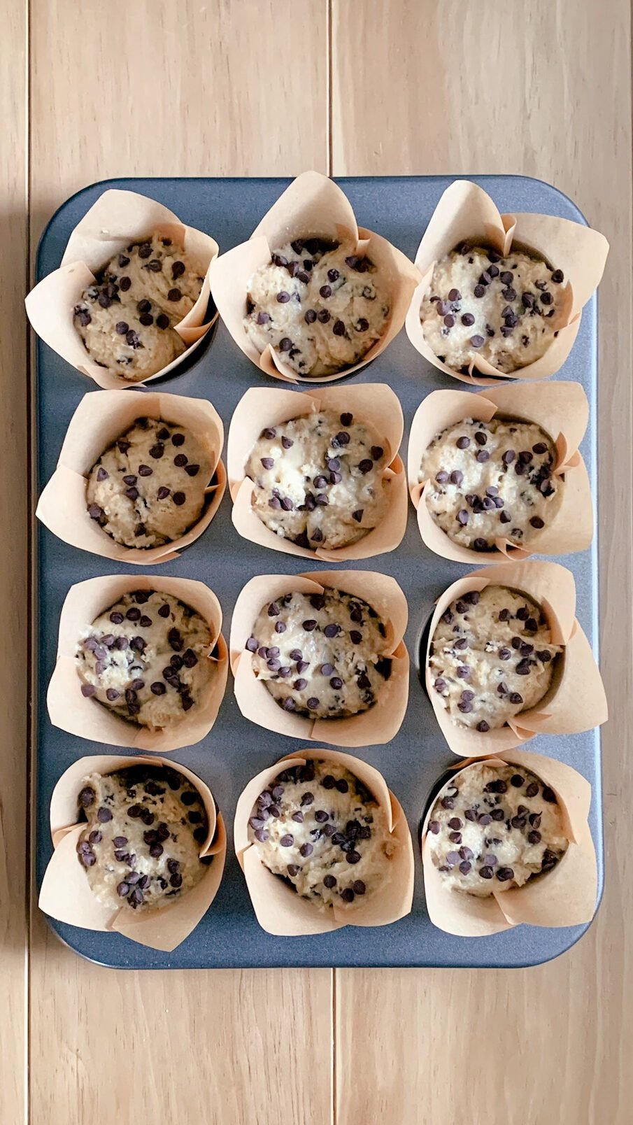 fresh milled chocolate chip muffins in the muffin pan before baking