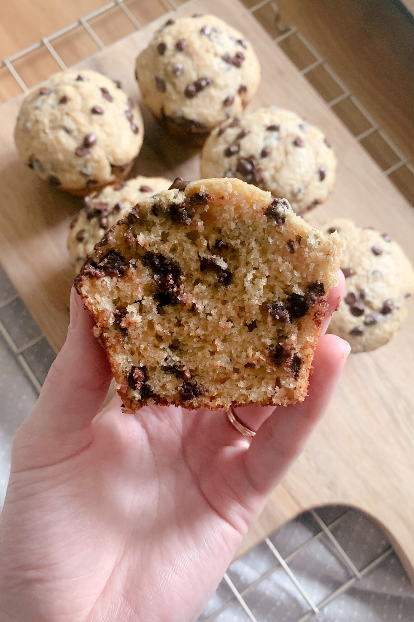 a close up view of a fresh milled chocolate chip muffin cut in half